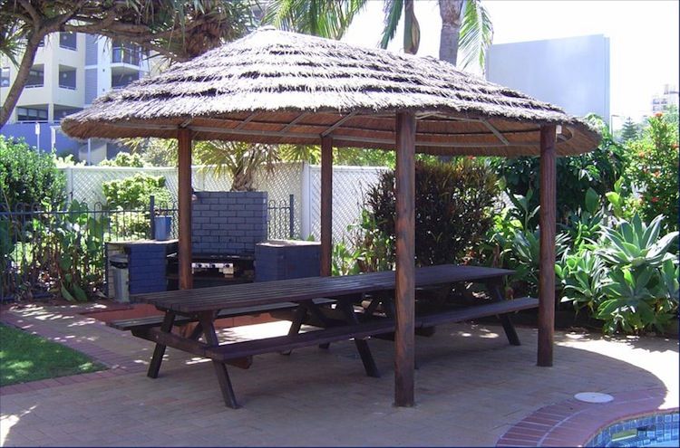 Thatched BBQ hut and picnic area at Casablanca Apartments